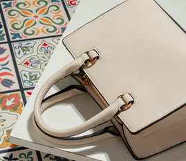 How should leather luggage be maintained? Is it prone to cracking?